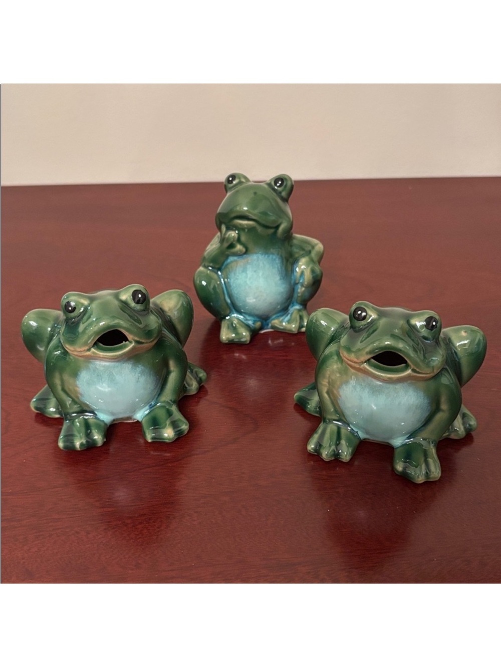 Set of three smooth ceramic green frog figurines